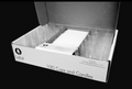 Open Candlelight Celebrations box with clear candle cups arranged beside white candles, labeled 100 Cups and Candles.